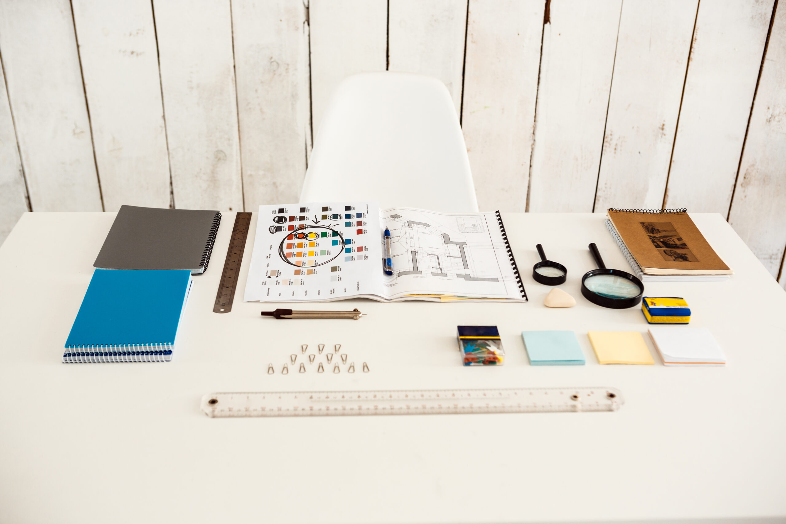 White modern office interior with light-colored wooden wall background.